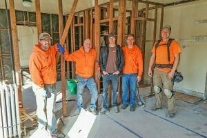 Image of a group shot of the Kingdon Builders, who were a build partner in a renovation of Avivo recovery housing.