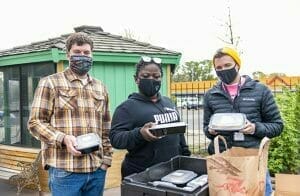 Avivo staff get ready to distribute meals in this image captured by Second Harvest Heartland staff.