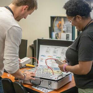Student participates in hands-on telecommunications Installation and Support Training. Training is free (for students who meet eligibility requirements).