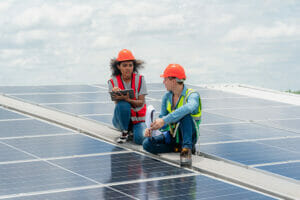 Image showing two people installing solar panels.