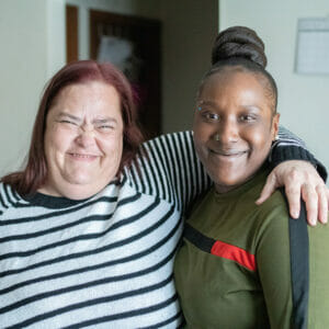 Two smiling women pose for a photo highlighting their success as Avivo participants.