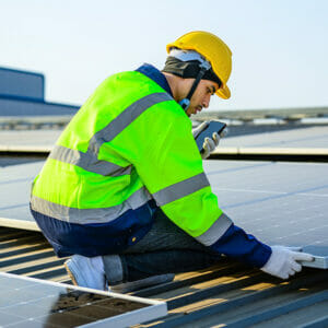 Image showing someone installing solar panels.