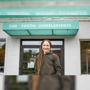 Kenzie from Wildflyer Coffee, a nonprofit coffee shop working to end youth homelessness, poses for the camera.