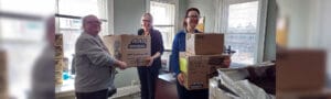Avivo staff move boxes and items to their new location along Chicago Avenue in Minneapolis.
