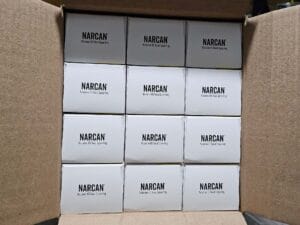 Photo of a box full of Narcan kits, part of Avivo's organization-wide high fidelity harm reduction strategy.